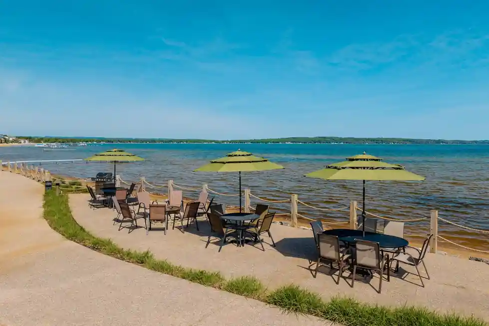 Umbrella patio on the edge of the bay seen from above the lodge