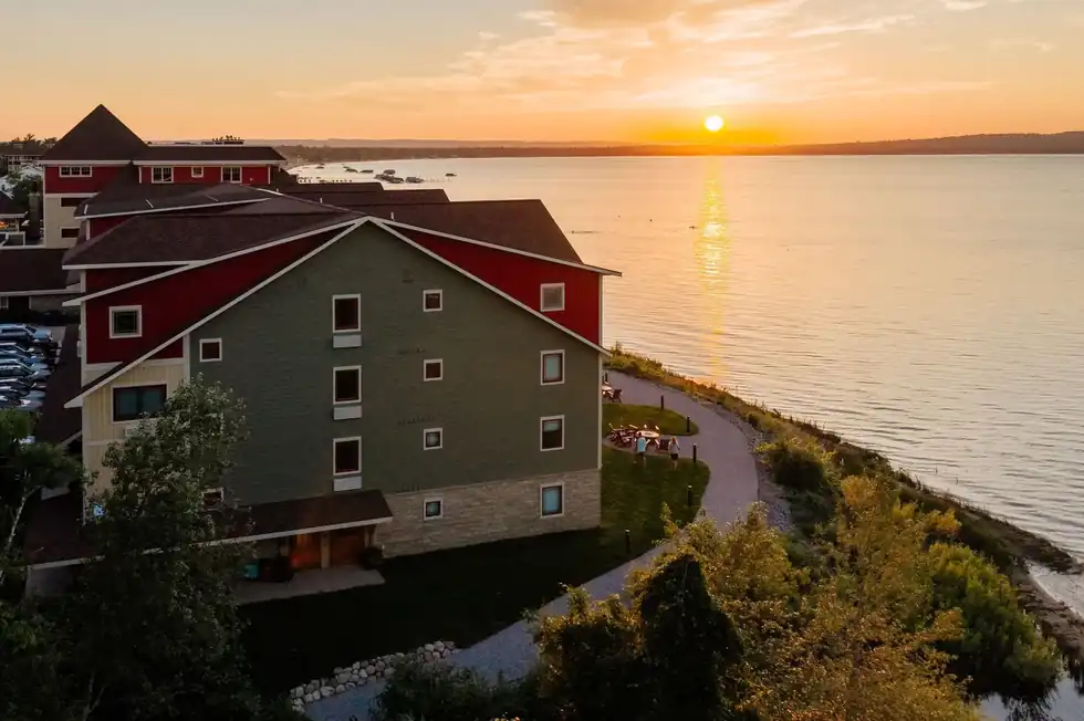 Sunset over East Grand Traverse Bay from above the lodge's red and green wings