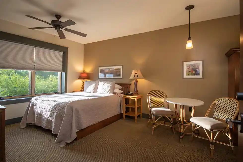 Guest room interior with a bed and window